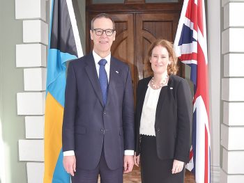 Sir Simon McDonald alongside and Sarah Dickson